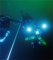 divers on mooring line